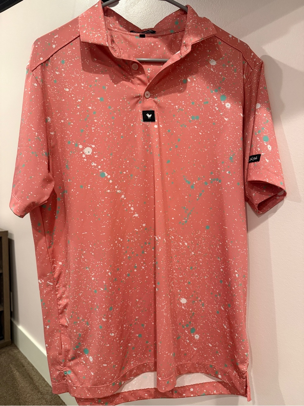 Bad Birdie Coral Polo with White and Teal Splatter